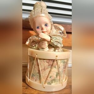 Musical In Motion Porcelain Doll with Drum Base Pink Floral Clown